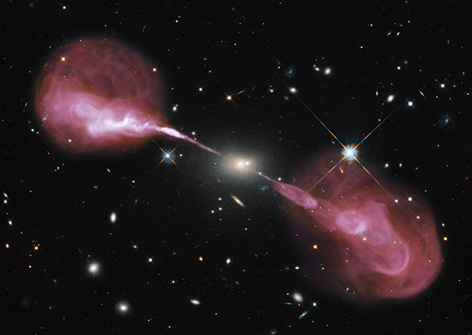 Radio jets from the elliptical galaxy Hercules A (overlaid with an optical image from Hubble). Karl Jansky VLA. Credit: NASA, ESA, S. Baum and C. O’Dea (RIT), R. Perley and W. Cotton (NRAO/AUI/NSF), and the Hubble Heritage Team (STScI/AURA).