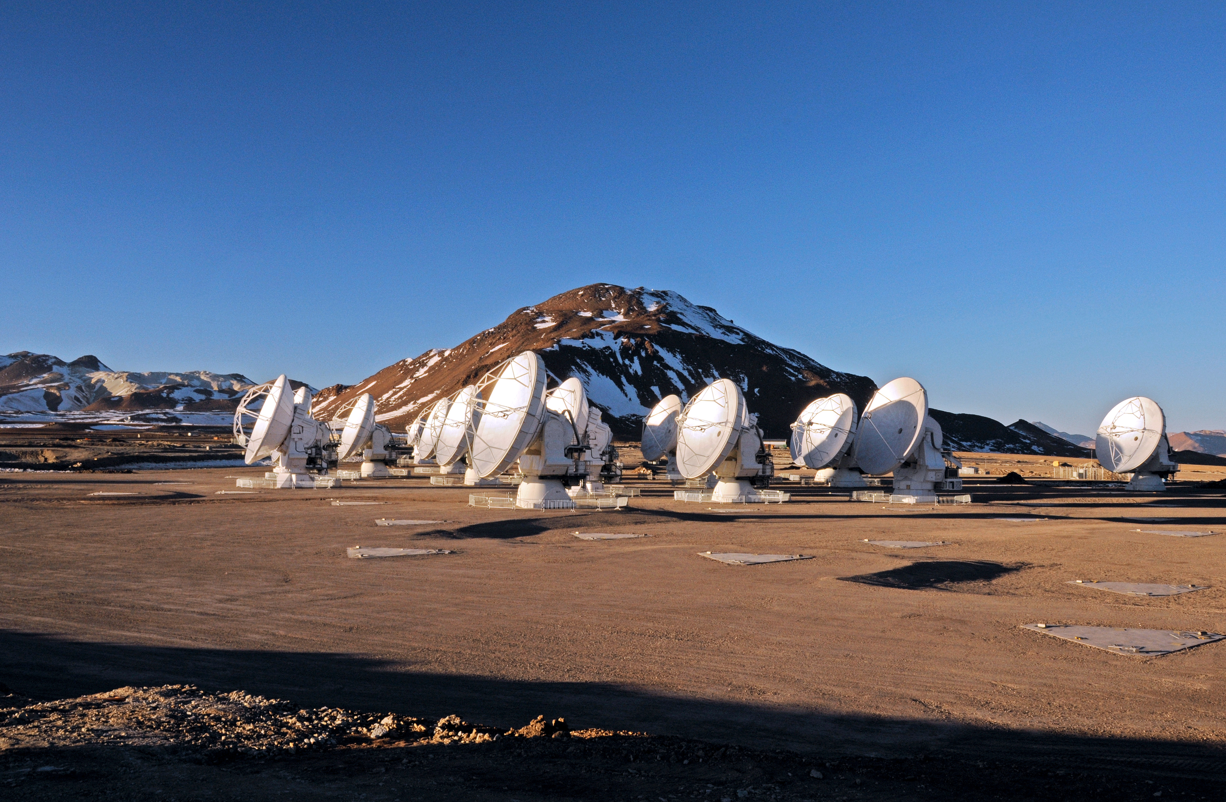 The Atacama Large (Sub)millimeter Array, an interferometric array of 66 antennas operating at sub-millimeter wavelengths. The largest antennas in the array are only 12m in diameter, yet through interferometry, the array is able to obtain far higher spatial resolution than the largest single-dish antennas. Credit: NRAO/ESO/NAOJ/JAO